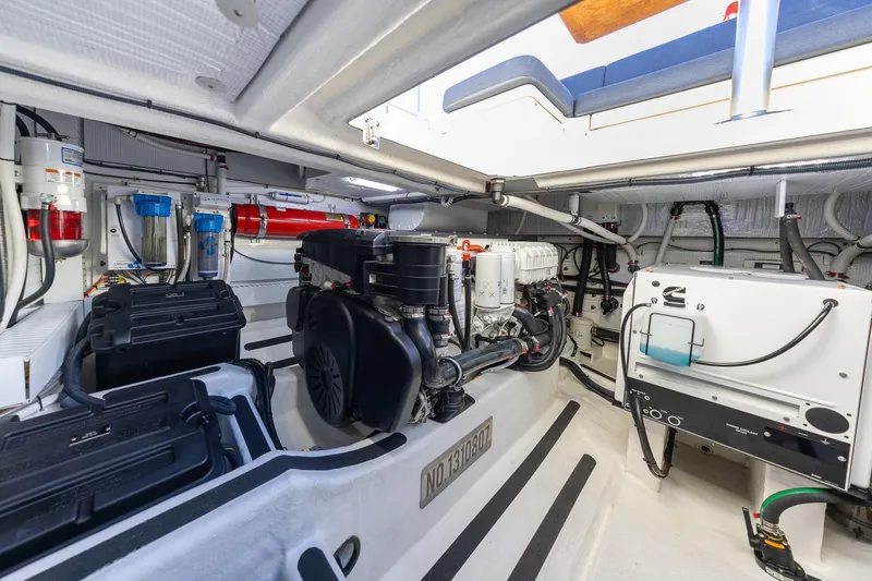 Slide: The Image of Engine room of 2021 Sabre 45 Salon Express yacht, showcasing mechanical components. - 44