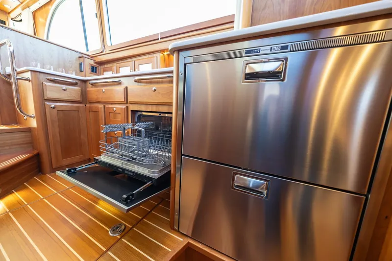 Slide: The Image of Modern kitchen interior of 2021 Sabre 45 Salon Express yacht with stainless steel appliances. - 23