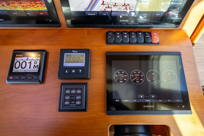 Slide: The Image of Control panel of 2021 Sabre 45 Salon Express with Garmin navigation displays. - 18