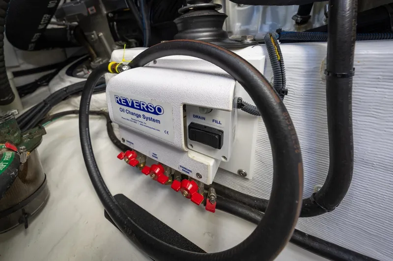 Slide: The Image of Reverso oil change system in 2021 Sabre 45 Salon Express engine room. - 45