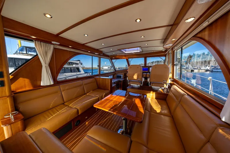 Slide: The Image of Luxurious interior of 2021 Sabre 45 Salon Express yacht with leather seating and panoramic windows. - 11