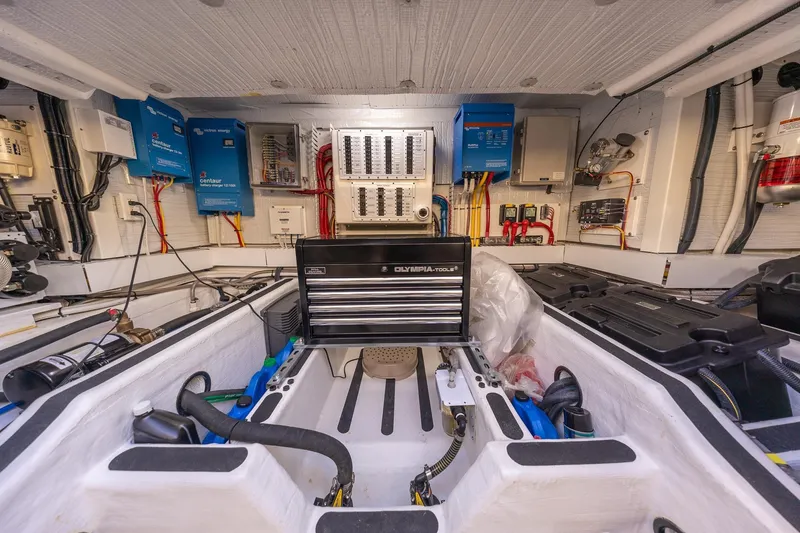 Slide: The Image of Engine room of 2021 Sabre 45 Salon Express with electrical panels and tool storage. - 39
