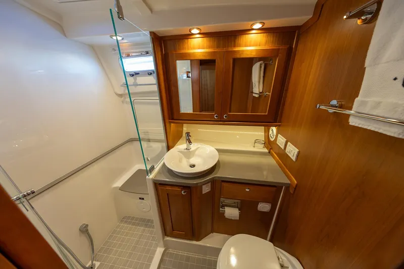 Slide: The Image of Luxurious bathroom in 2021 Sabre 45 Salon Express yacht with wood cabinetry and modern fixtures. - 32