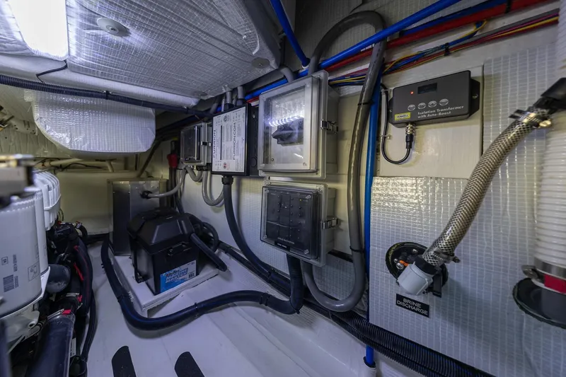 Slide: The Image of Engine room of 2021 Sabre 45 Salon Express with electrical panels and wiring. - 42