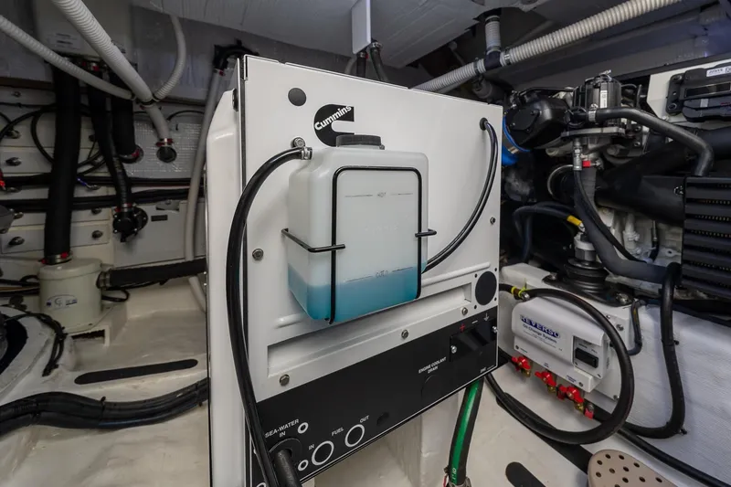 Slide: The Image of Engine room of 2021 Sabre 45 Salon Express with Cummins components and coolant system. - 43