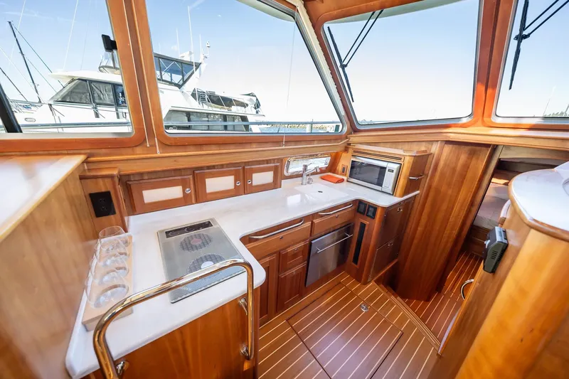 Slide: The Image of Interior of 2021 Sabre 45 Salon Express yacht with modern kitchen amenities. - 21