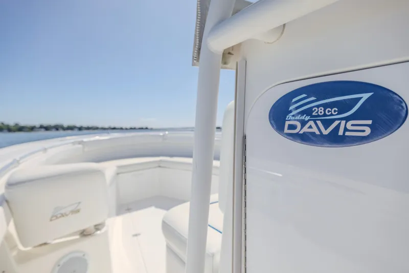 Slide: The Image of 2016 Buddy Davis 28 Center Console boat on calm water, featuring logo detail. - 12