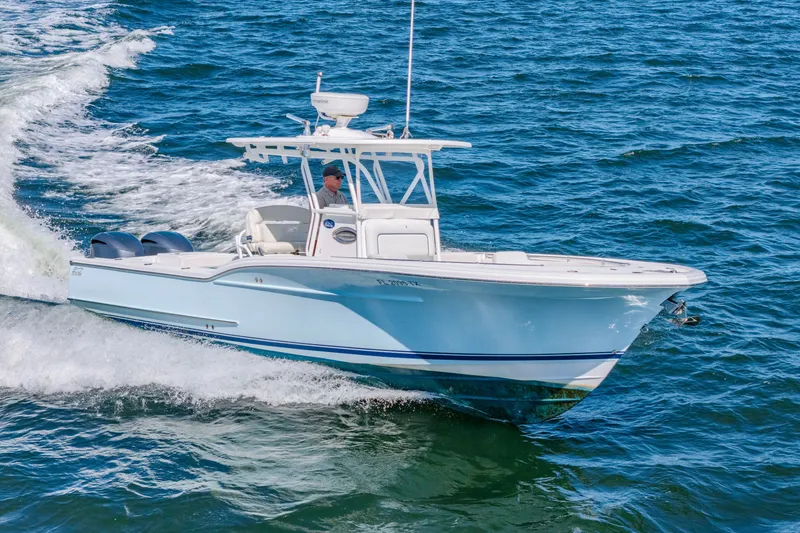 Slide: The Image of 2016 Buddy Davis 28 Center Console boat cruising on open water. - 1