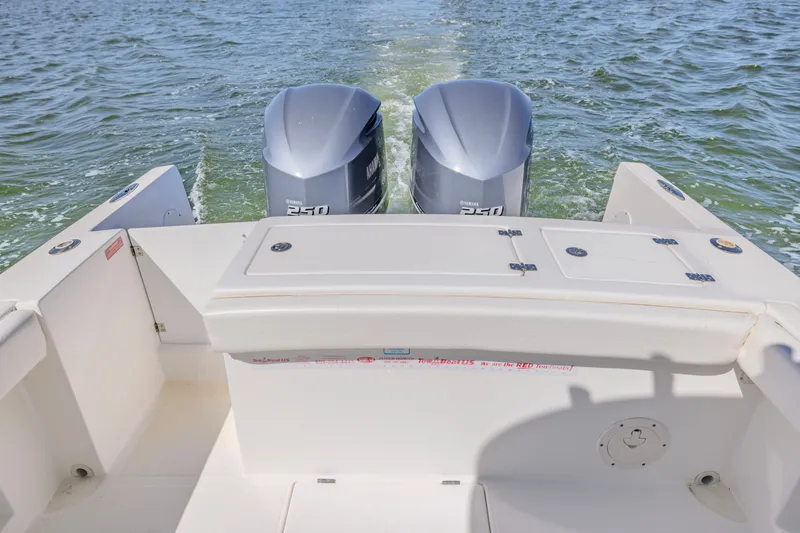Slide: The Image of 2016 Buddy Davis 28 Center Console boat with dual Yamaha 250 engines on water. - 17