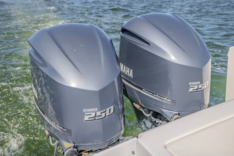 Slide: The Image of Twin Yamaha 250 outboard engines on a 2016 Buddy Davis 28 Center Console boat. - 10