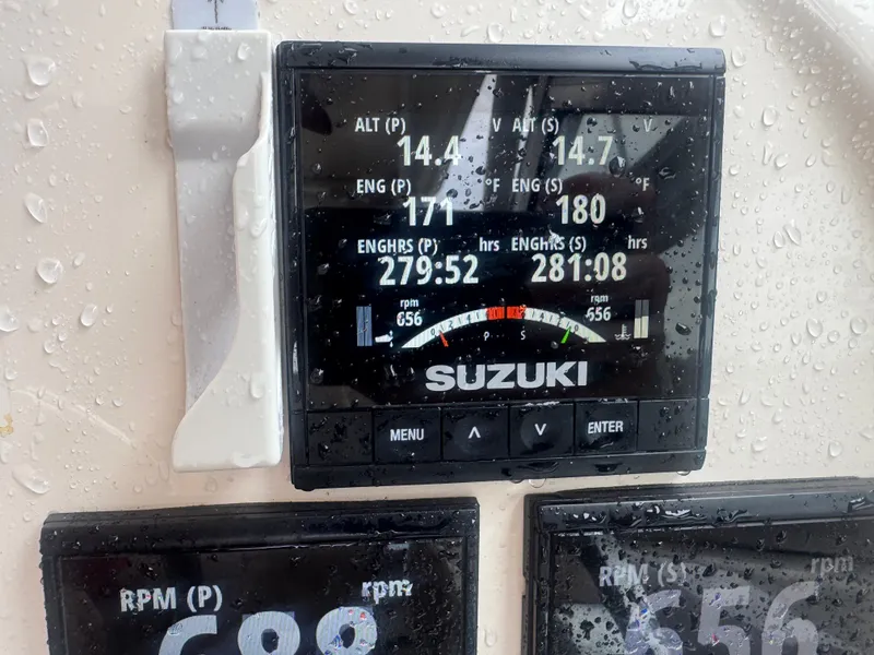 Slide: The Image of A Suzuki engine display shows various engine data, including RPM and engine hours. - 12