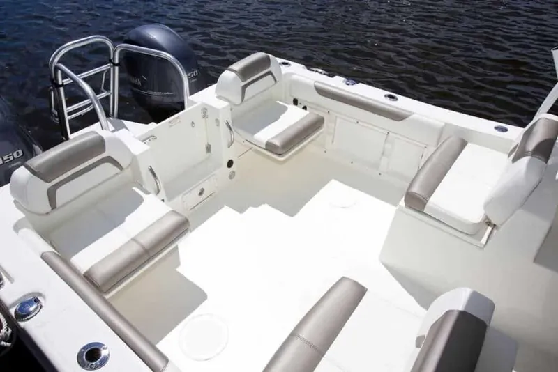Slide: The Image of The image shows the cockpit of a 2013 World Cat 255 DC boat with comfortable seating. - 5