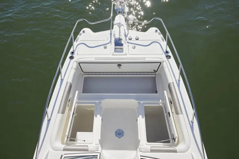 Slide: The Image of Bow of a 2013 World Cat 255 DC with storage compartments and stainless steel railing. - 7