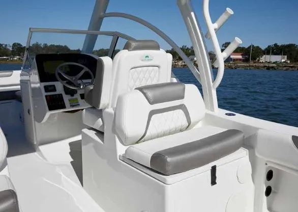 Slide: The Image of The image shows the cockpit of a 2013 World Cat 255 DC with white and gray seating. - 18