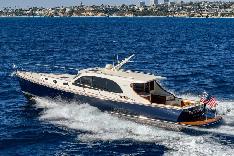Slide: The Image of 2019 Palm Beach Motor Yachts Express cruising on blue ocean near coastline. - 39
