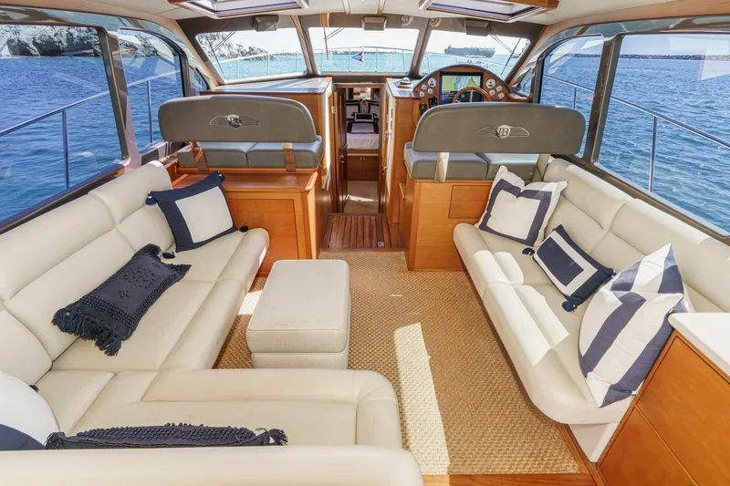 Slide: The Image of Luxurious interior of 2019 Palm Beach Motor Yachts Express with elegant seating and ocean view. - 14