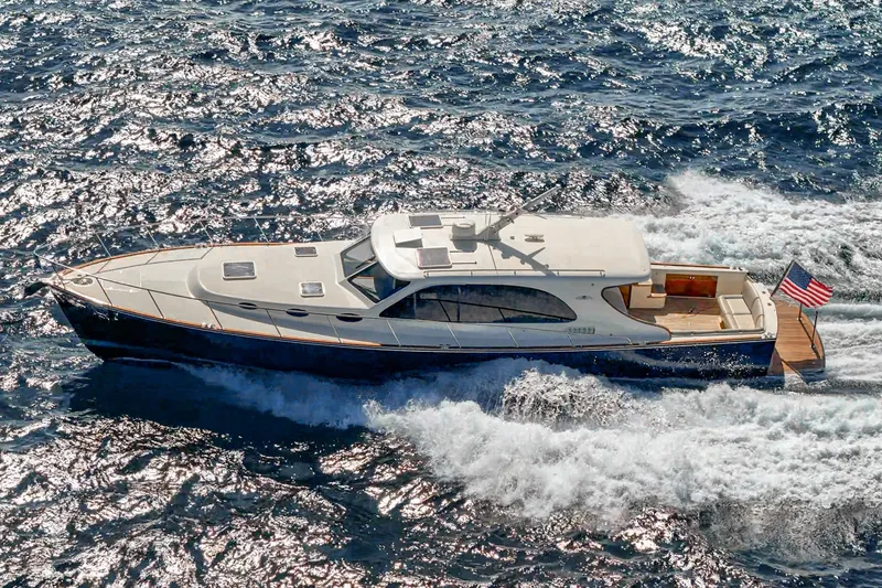 Slide: The Image of 2019 Palm Beach Motor Yachts Express cruising on open water. - 40