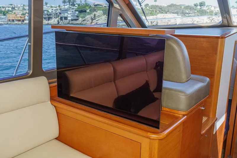 Slide: The Image of Luxurious interior of 2019 Palm Beach Motor Yachts Express with TV and seating. - 15