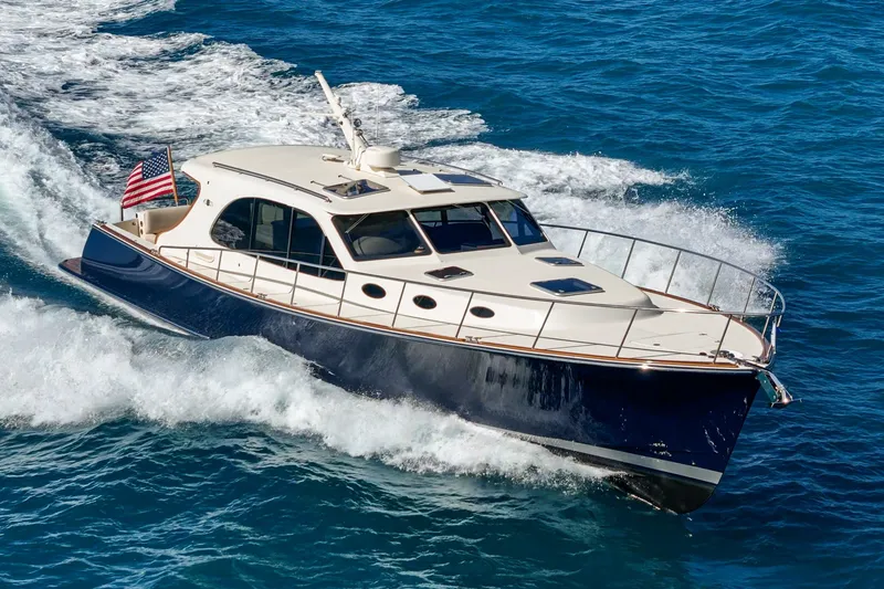 Slide: The Image of 2019 Palm Beach Motor Yachts Express cruising on blue ocean waters. - 50