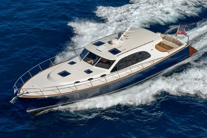 Slide: The Image of 2019 Palm Beach Motor Yachts Express cruising on open blue waters. - 45