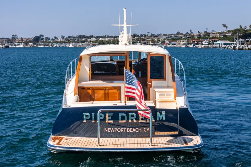 Slide: The Image of 2019 Palm Beach Motor Yachts Express on water, Newport Beach, American flag displayed. - 35