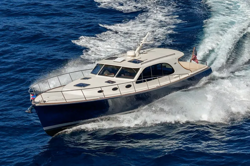 Slide: The Image of 2019 Palm Beach Motor Yachts Express cruising on open blue waters. - 47