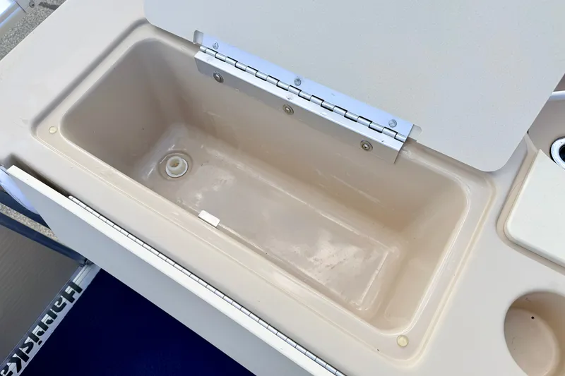 Slide: The Image of Open storage compartment on 2000 Harris-Kayot Classic 220 O/B boat. - 34