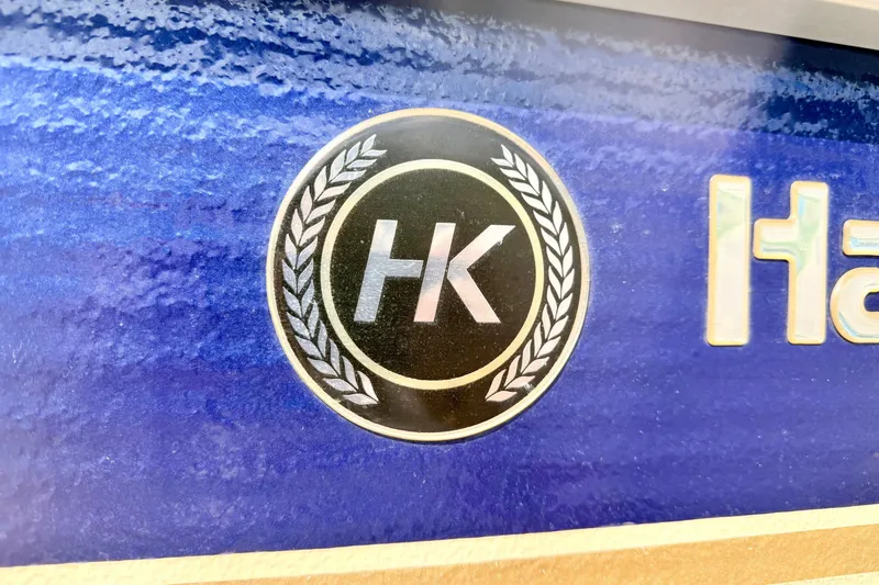 Slide: The Image of Logo of Harris-Kayot Classic 220 O/B boat, 2000 model, on a blue background. - 13