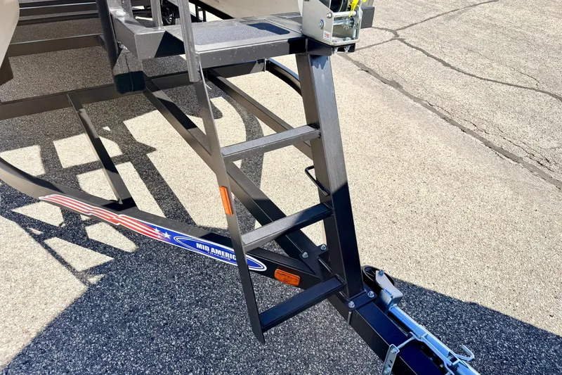Slide: The Image of Trailer hitch and ladder for 2000 Harris-Kayot Classic 220 O/B boat. - 79