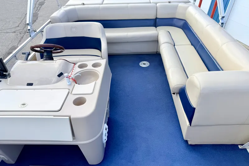Slide: The Image of Interior of 2000 Harris-Kayot Classic 220 O/B boat with blue and beige seating. - 29