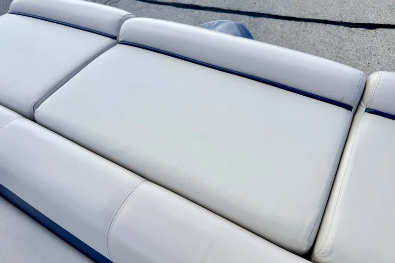 Slide: The Image of White cushioned seating on a 2000 Harris-Kayot Classic 220 O/B boat. - 45