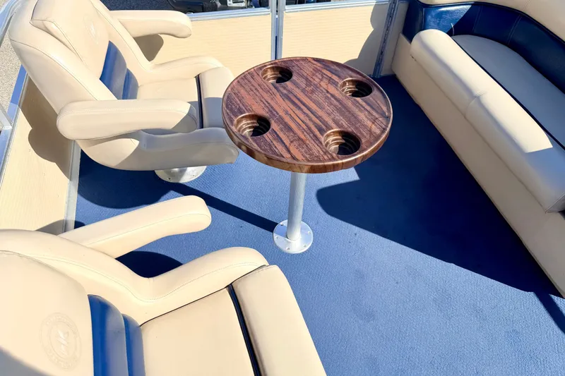 Slide: The Image of Interior of 2000 Harris-Kayot Classic 220 O/B boat with seating and wooden table. - 56
