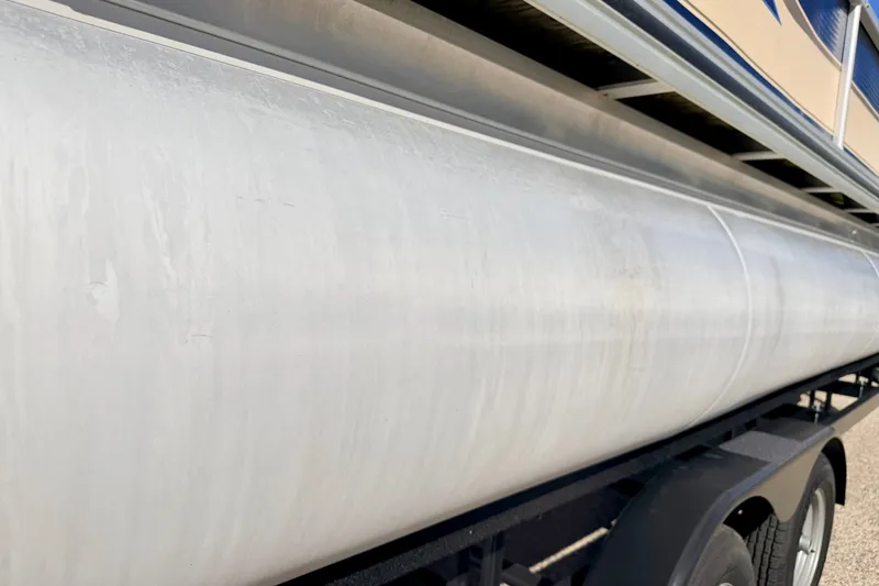 Slide: The Image of Close-up of a 2000 Harris-Kayot Classic 220 O/B pontoon on a trailer. - 16