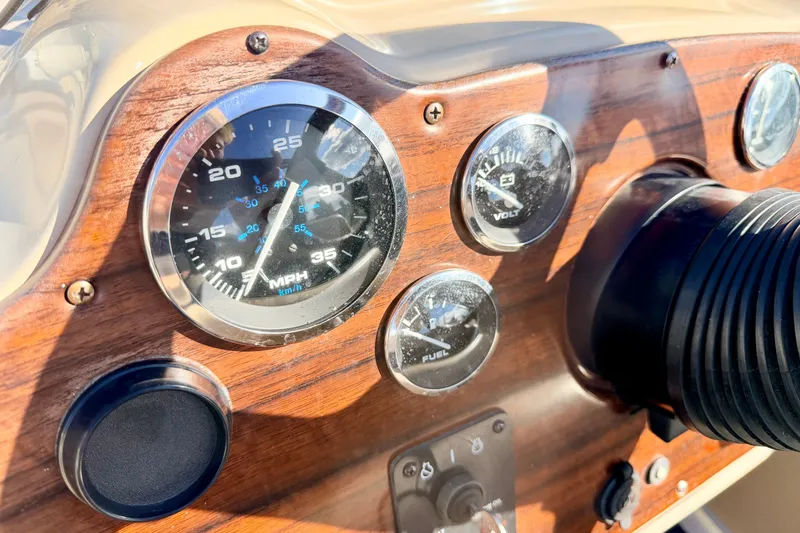 Slide: The Image of Dashboard of a 2000 Harris-Kayot Classic 220 O/B boat with speedometer and gauges. - 59