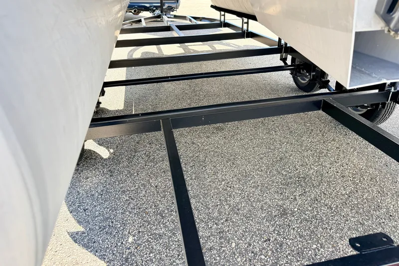 Slide: The Image of Trailer frame for 2000 Harris-Kayot Classic 220 O/B boat on pavement. - 76