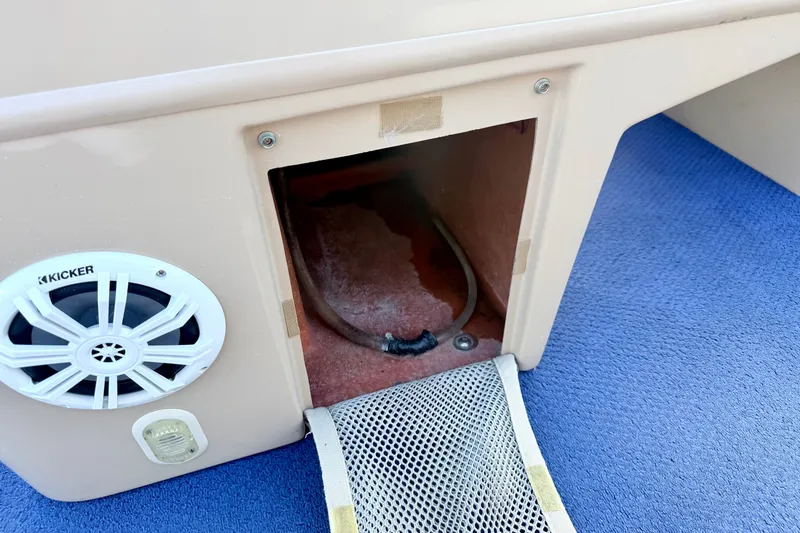 Slide: The Image of Harris-Kayot Classic 220 O/B 2000 boat interior with speaker and storage compartment. - 52