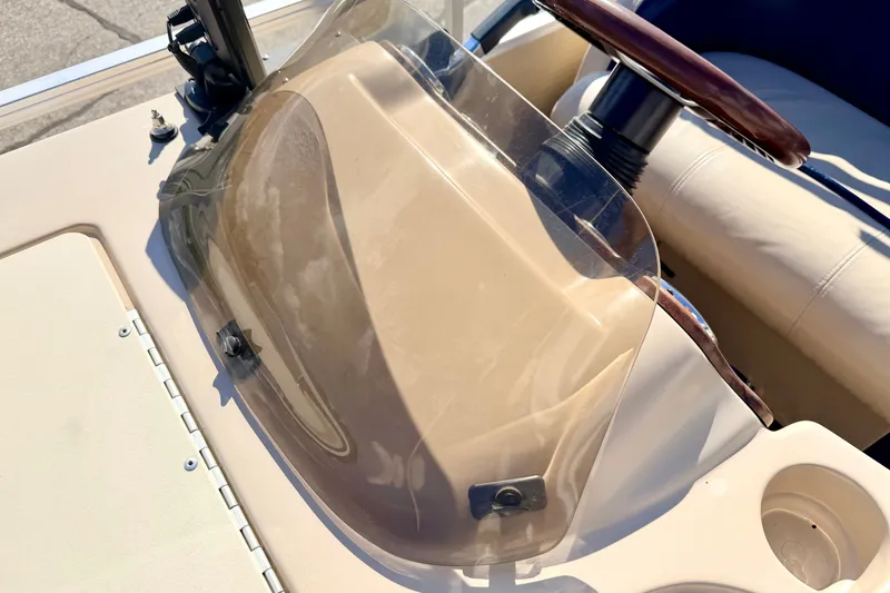 Slide: The Image of 2000 Harris-Kayot Classic 220 O/B boat dashboard with steering wheel and windshield. - 67