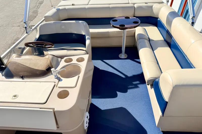 Slide: The Image of Interior of 2000 Harris-Kayot Classic 220 O/B boat with beige and blue seating. - 54