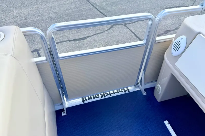 Slide: The Image of Interior view of a 2000 Harris-Kayot Classic 220 O/B boat with blue flooring. - 48