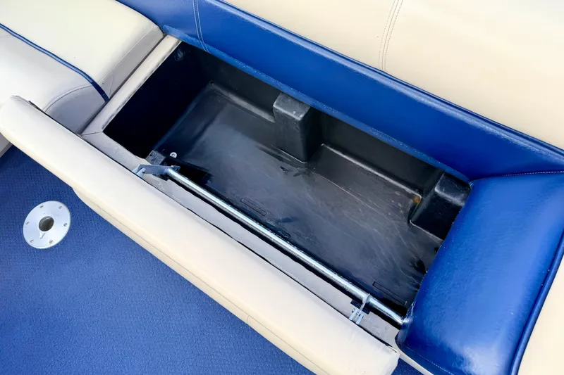 Slide: The Image of Open storage compartment on a 2000 Harris-Kayot Classic 220 O/B boat seat. - 36