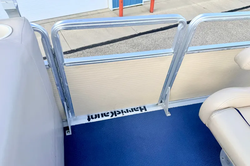 Slide: The Image of Interior view of a 2000 Harris-Kayot Classic 220 O/B boat with blue flooring. - 49