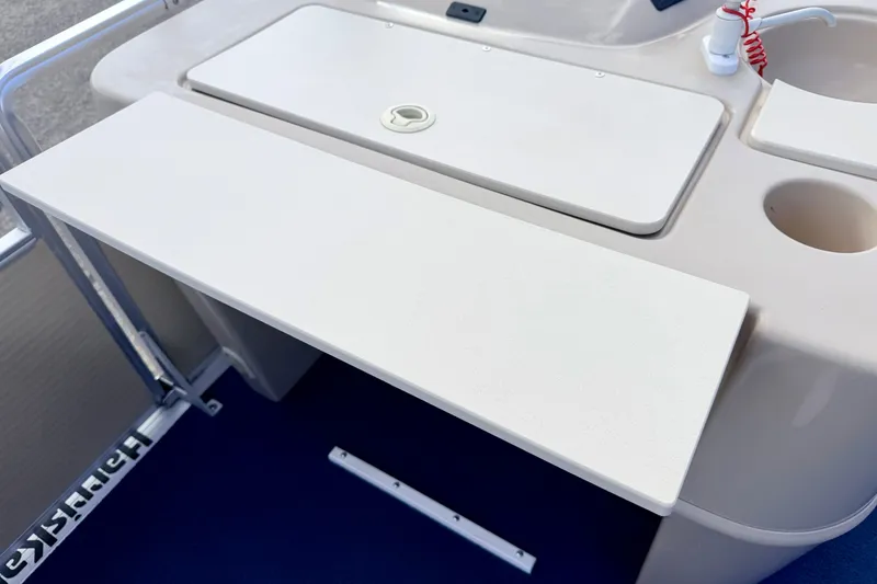 Slide: The Image of Interior view of a 2000 Harris-Kayot Classic 220 O/B boat, featuring a clean white countertop. - 31