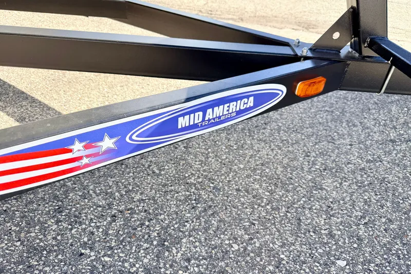 Slide: The Image of Trailer frame with "Mid America Trailers" logo, featuring stars and stripes design. - 78