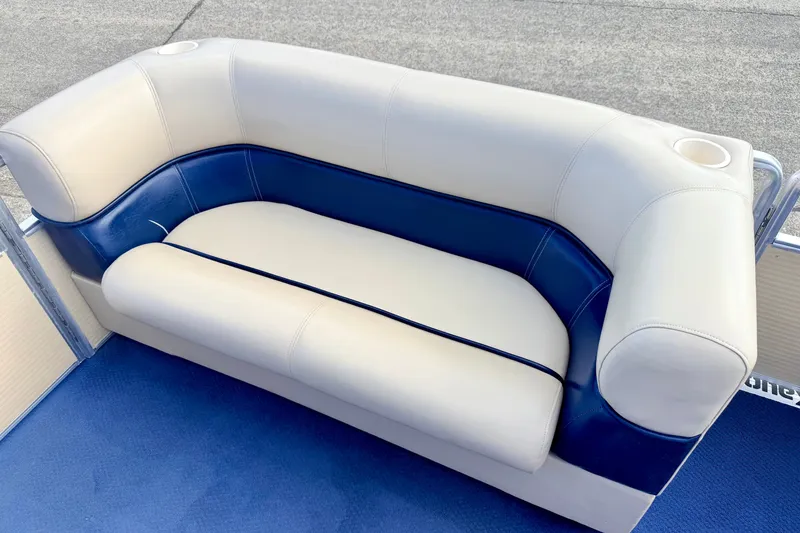 Slide: The Image of White and blue boat seating on 2000 Harris-Kayot Classic 220 O/B. - 24