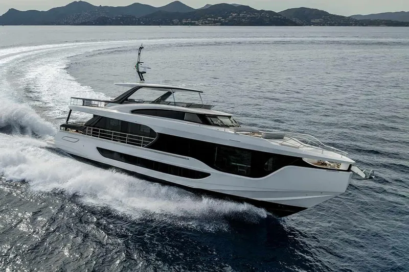 The Image of Manufacturer Provided Image: Luxury yacht Azimut Grande 26M 2025 cruising on open water, scenic mountain backdrop. - 0