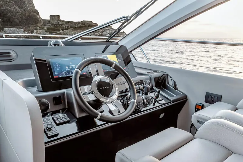 Slide: The Image of Manufacturer Provided Image: Helm of 2025 Azimut Fly 53 yacht with modern controls and ocean view. - 14