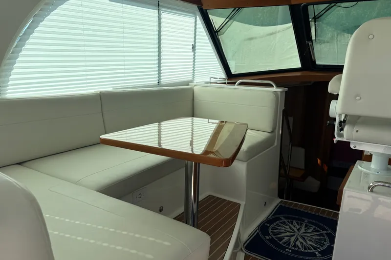 Slide: The Image of Luxurious interior of 2025 Back Cove 39O yacht with elegant seating and table. - 26