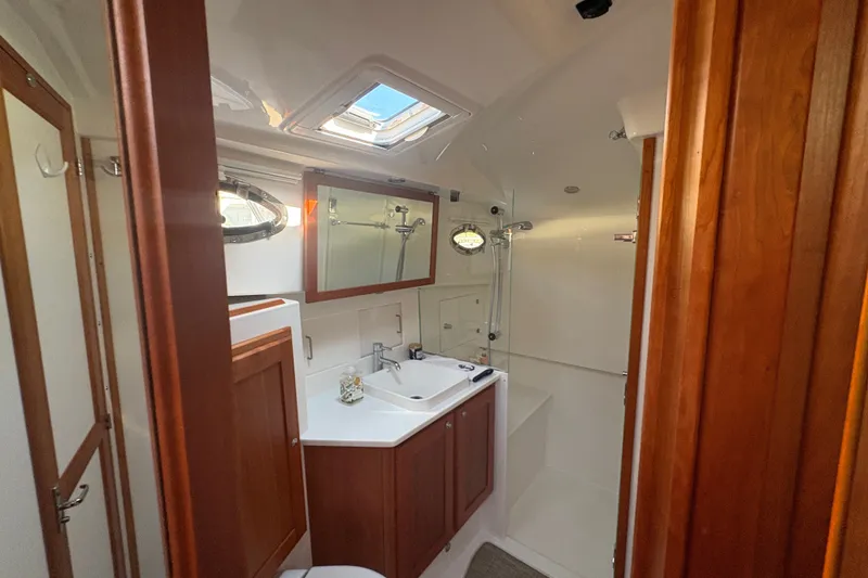 Slide: The Image of Luxurious bathroom interior of 2025 Back Cove 39O yacht with wood accents and skylight. - 15