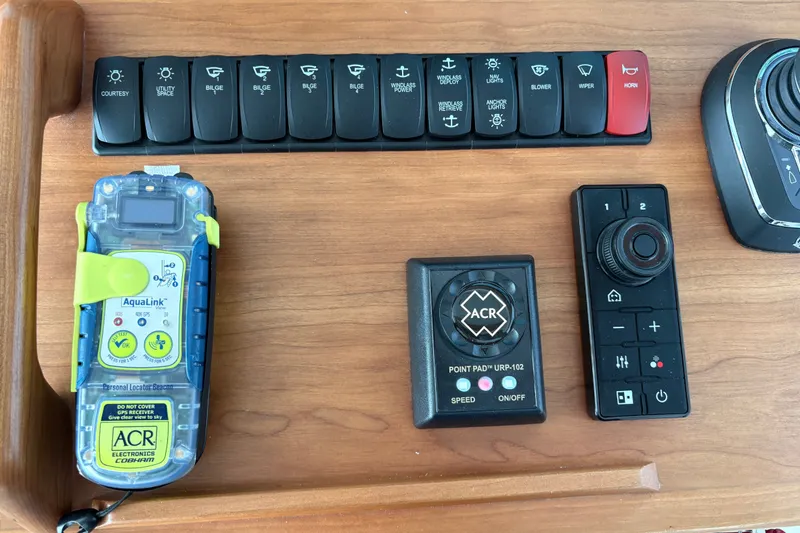 Slide: The Image of Control panel of a 2025 Back Cove 39O boat with navigation and safety devices. - 29