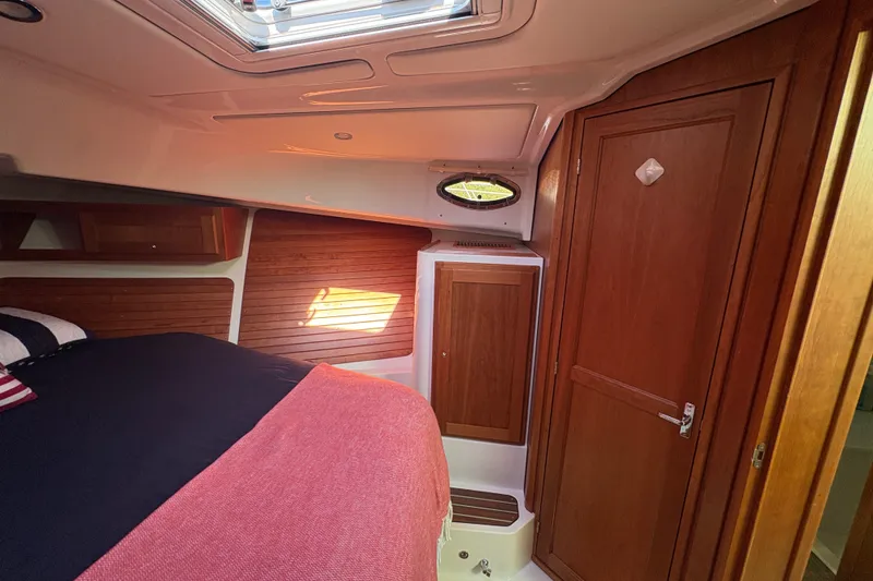 Slide: The Image of Luxurious cabin interior of 2025 Back Cove 39O yacht with wood paneling and skylight. - 9